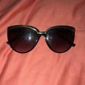 gold lined black sunglasses